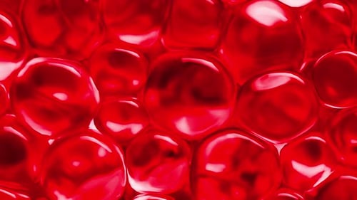 Red spheres moving and reflecting light