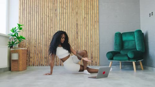 Woman Doing Yoga with Online Video