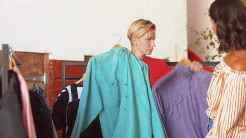 Two Women Shopping for Clothes in a Store