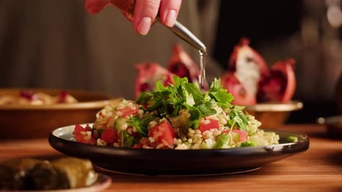 Fresh Salad Being Drizzled With Oil