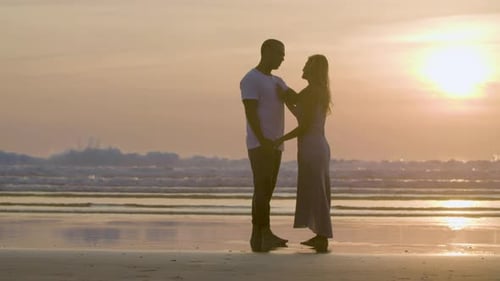 Romantic Couple Kissing on Beach at Sunset