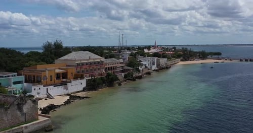 Aerial view of coastal buildings and pier, Mozambique.