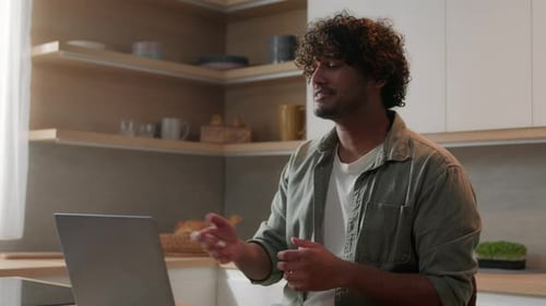 Smiling Young Man Having Video Call at Home
