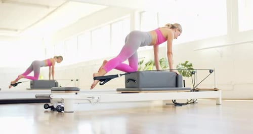 Young Adult Woman Doing Pilates Leg Extension