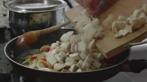 Cooking Vegetables: Mushrooms Being Added to Sautéed Veggies