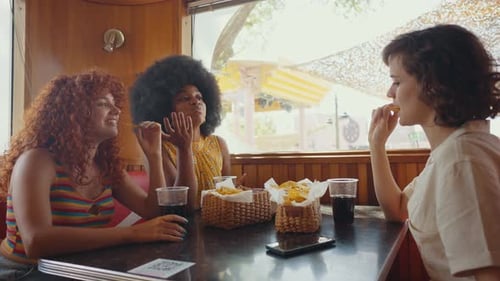 Group of friends eating in a diner restaurant