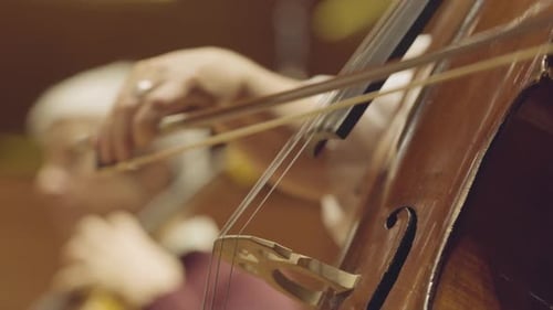 playing a cello, very close