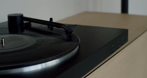 Turntable Plays Vinyl Record in Minimalist Home