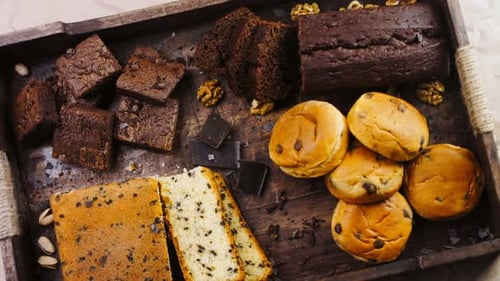 Different Kinds of Cakes Arranged on a Wooden Tray