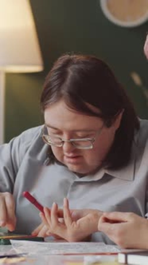 Two People Coloring Together Indoors