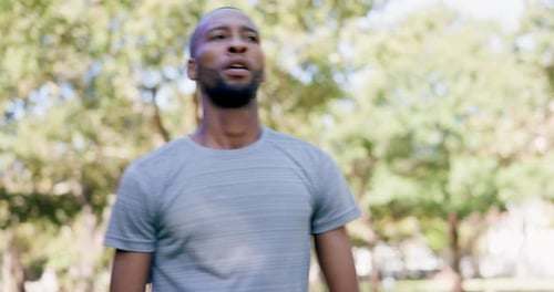 Man Running in a Park on a Sunny Day