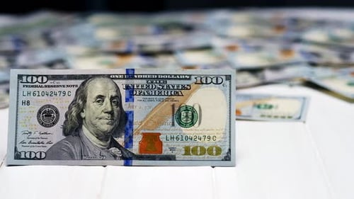 Dollar Hundred Bill on the Background of Dollars