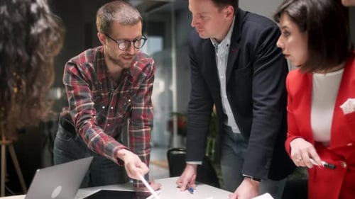 Team Collaborating on Project in Bright Modern Office