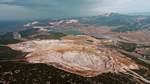 Aerial View of Vast Quarry in Mountainous Landscape