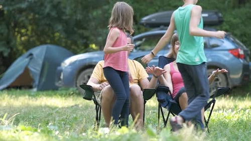 Happy Family Camping Together in the Outdoors