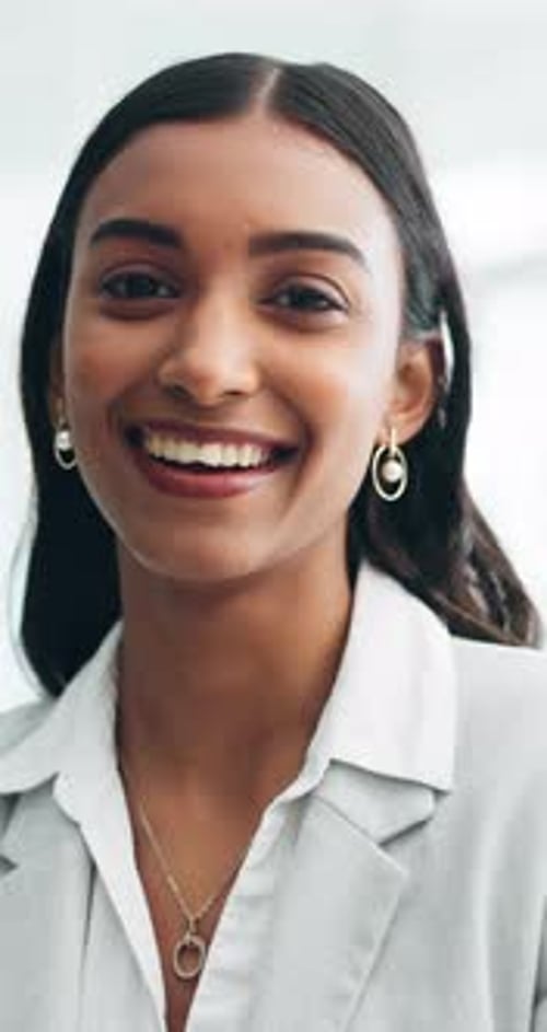 Smile, professional and face of business woman in office for pride, confidence and corporate