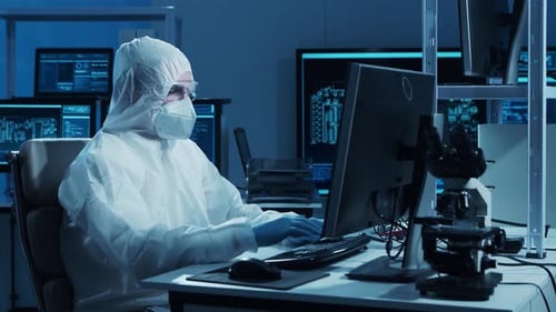 Microelectronics Engineer Works in a Modern Scientific Laboratory on Computing Systems and