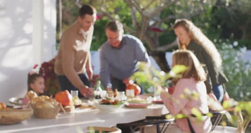 Family Together at Table Outside, Preparing Meal