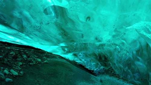 Icy Glacier Cave with Translucent Blue Ice