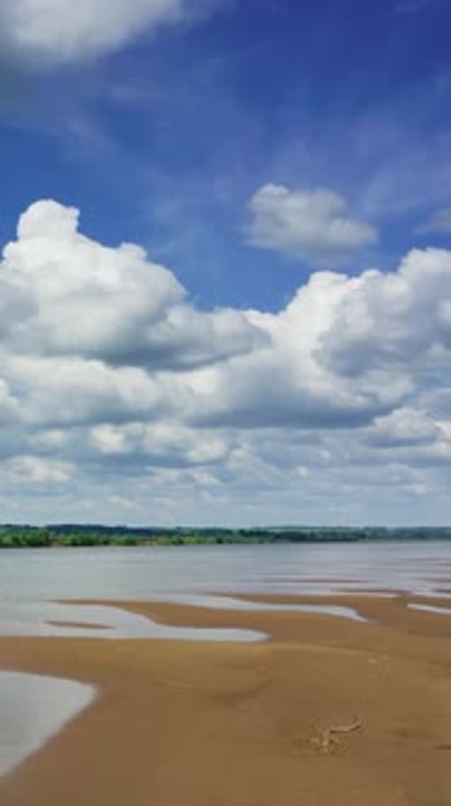 Clouds Over River Landscape