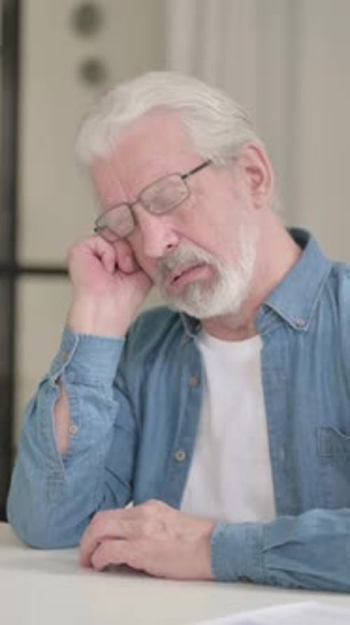 Tired Senior Old Man Taking Nap in Office, Vertical Video