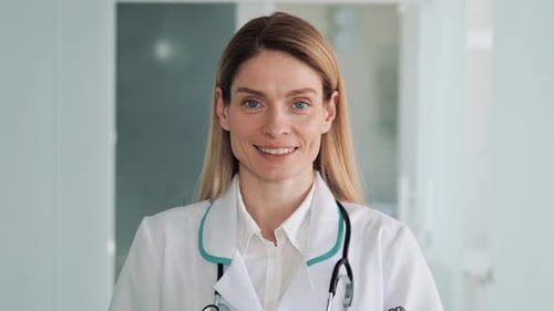Close Up Portrait of Cheerful Adult Young Beautiful Caucasian Female Doctor