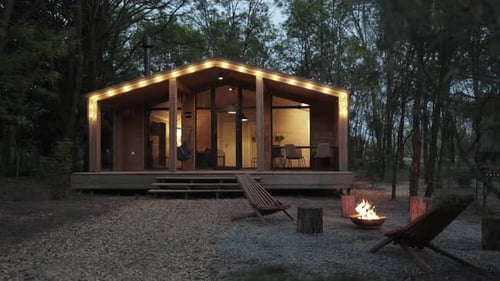 Cozy Cabin with Fire Pit at Night