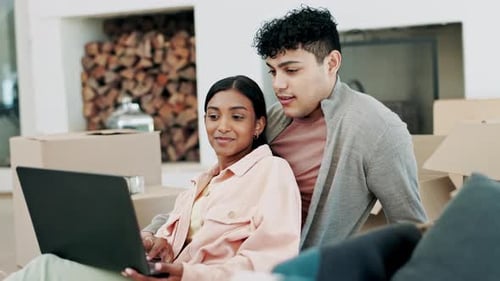 Couple, boxes and laptop in real estate planning, new home or moving in property together