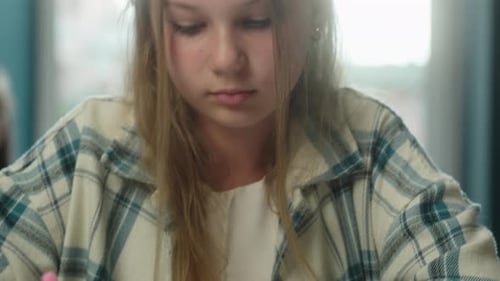 Focused Caucasian Teen School Little Girl Writing Homework Inside Classroom Preparing Exam