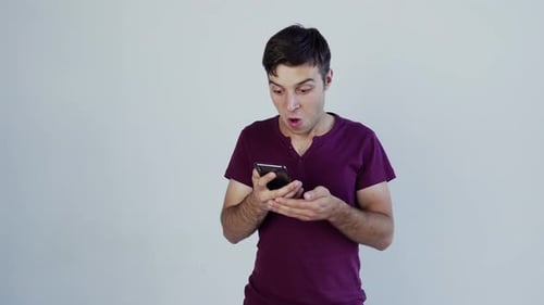 Excited Man Celebrates Good News on Phone