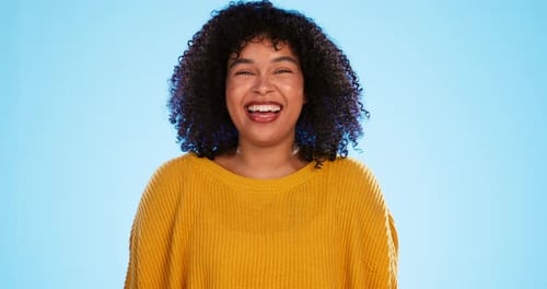 Happy black woman, face and beauty in studio by blue background for fashion, smile and wellness