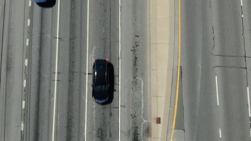 Aerial top down perspective of traffic on multi-lane highway, roadway