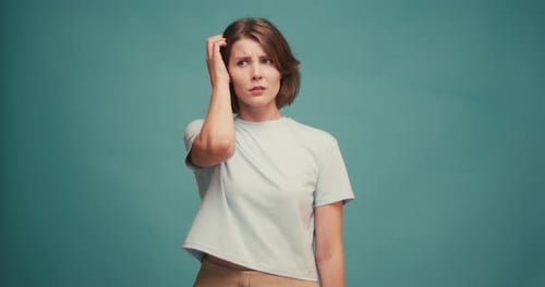 I Don't Know Confused Beautiful Brunette Woman in Casual Style Shows Desorientation and Confusion