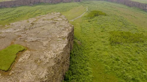 Scenic Asbyrgi Glacial Canyon Under Clouds In Iceland - aerial drone shot