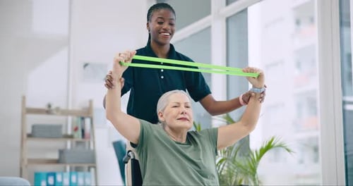 Senior Woman Doing Assisted Exercises with Resistance Band