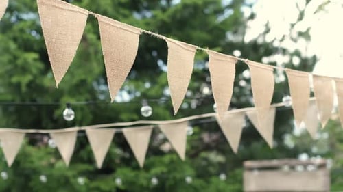 Summer Nights Redefined Elevate your Outdoor Gatherings with Beige Triangle Flags and Softglowing