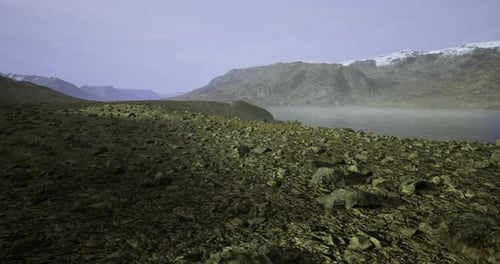 Exploring the Rugged Terrain By the Tranquil Glacier Lake at Dusk