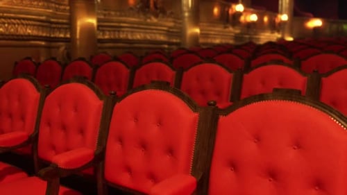 Elegant Red Velvet Chairs Arranged in an Old Opera House Auditorium