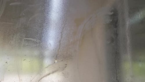 Condensation on a dirty window.