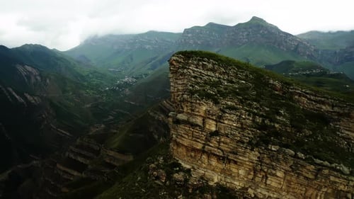 Sunlight on Cliff's Edge Over Valley