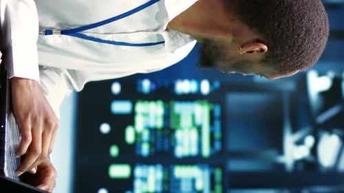 Focused Man Typing Code at Computer Workplace