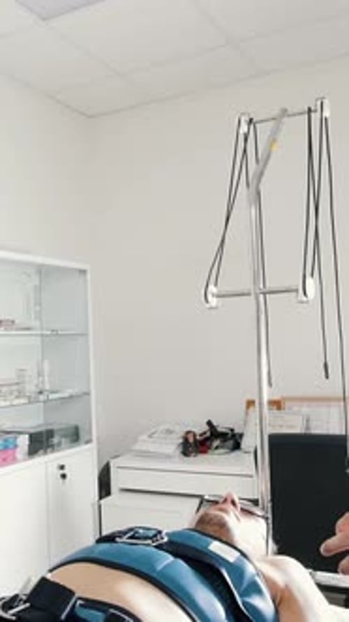 The Asian Doctor Chiropractor Conducts the Procedure of Stretching the Back Chiropractic Asian
