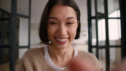 Webcam Screen View Happy Hispanic Woman at Home Laughing Typing on Mobile Phone Smartphone Latino