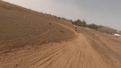 Motorcycle Rider on Rural Dirt Track Adventure