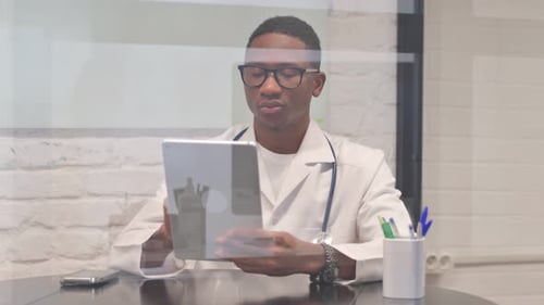 Doctor Using Tablet in Modern Medical Office