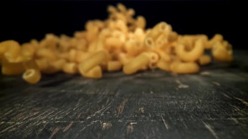 Dry Pasta Falls on the Table Filmed on a Highspeed Camera at 1000 Fps