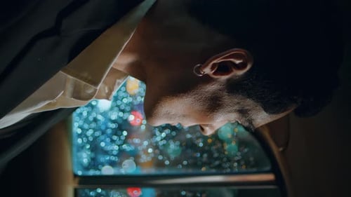 Serious Man Staring Car Window at Night Closeup Manager Looking City Vertically