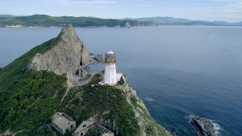 Aerial Orbital View of an Old Lighthouse on the Cliff on Pacific Coast Beautiful Panoramic Seascape