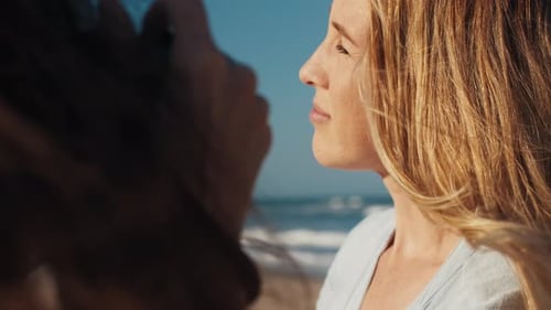 Blonde Woman at Beach Touched Affectionately