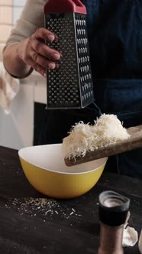 Girl Chef Grating Hard Parmesan Cheese